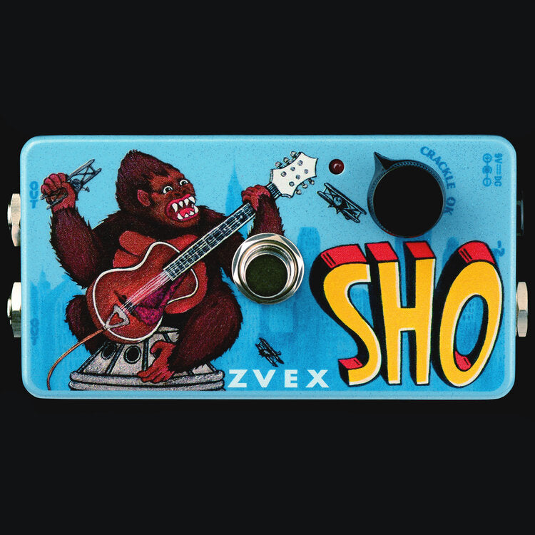 A high-end ZVEX Effects Vexter SHO Super Hard On gorilla with a guitar on a blue background.