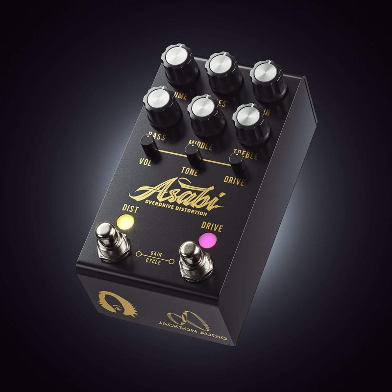 The Jackson Audio Asabi Overdrive Distortion Mateus Asato Signature Pedal is a sleek black and gold guitar pedal with a gold knob. It offers an ASABI distortion tone that rivals even the best analog distortion plug-ins.