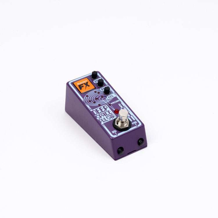A Rainger FX Deep Space Pulsar Including Igor & Mic, a small purple pedal with a knob on it, designed for digital delay with Echo-X capabilities.