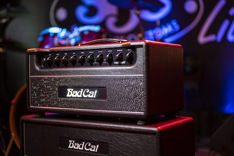 A reimagined stack of Bad Cat Amplifiers Hot Cat Head 45W 2 Channel Amps in front of a stage, each channel ready to unleash powerful sounds.