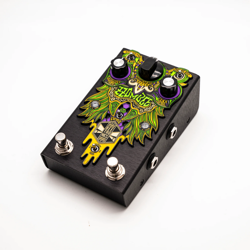A Beetronics FX Zzombee Filtremulator analog multi-effect pedal with a black and green design featuring a colorful pattern.
