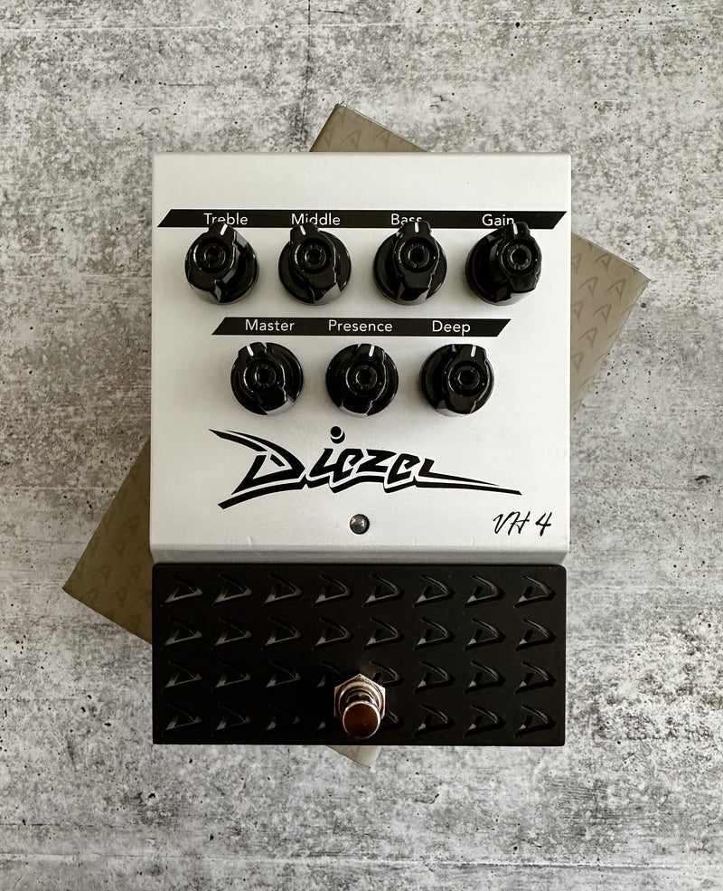 A black and white Diezel VH4 Overdrive pedal with a knob on it, delivering Diezel tone overdrive.