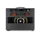 A Bad Cat Jet Black guitar amplifier sitting on a wooden floor, providing the perfect volume and tones for any musical performance.