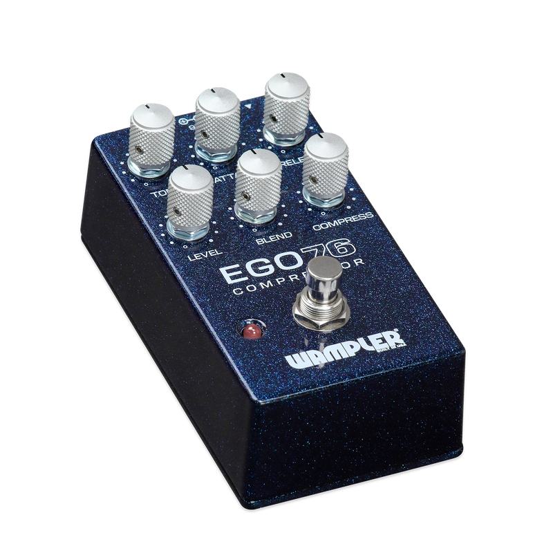 The Wampler Ego 76 Compressor Pedal is a blue pedal with four knobs on it.