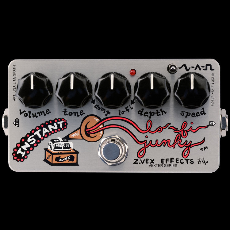 A black and white image of a ZVEX Effects Vexter Instant Lo-Fi Junky pedal, designed to emulate vintage guitar effects, featuring four knobs.