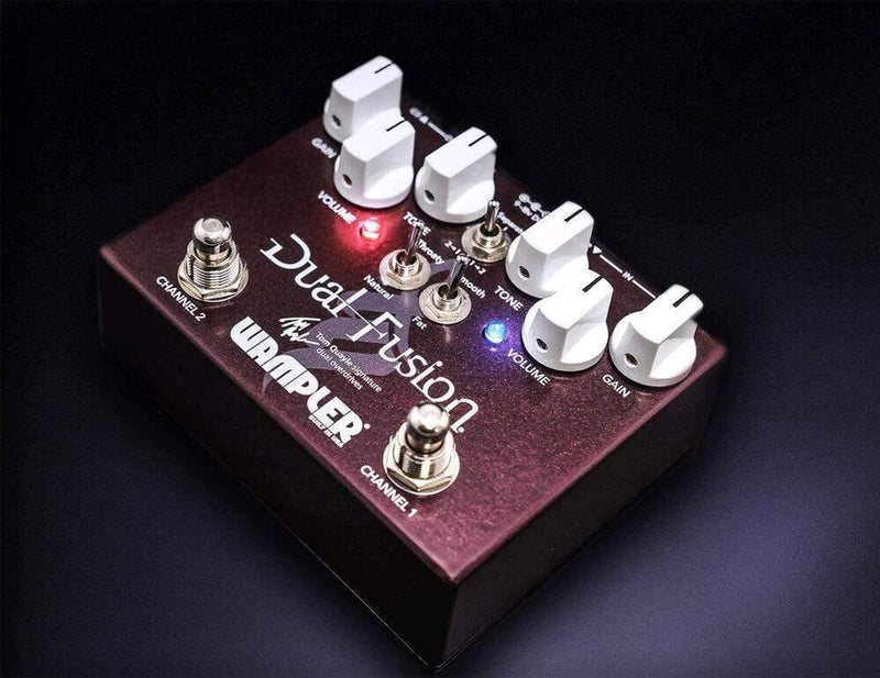 A Wampler Dual Fusion Tom Quayle Signature Overdrive V2 guitar pedal with two knobs for adjusting tones.