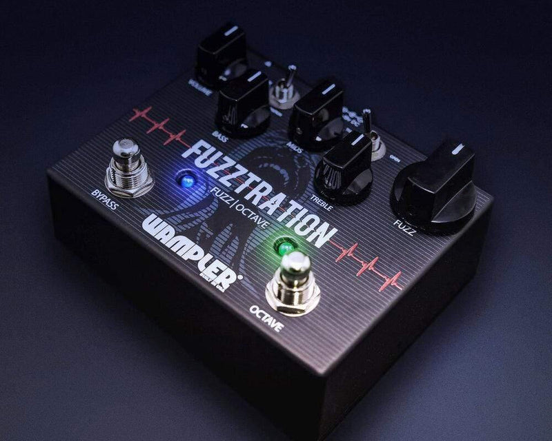 A Wampler Fuzztration Fuzz guitar pedal with two knobs on it, offering vintage-inspired tones and a three-band EQ.