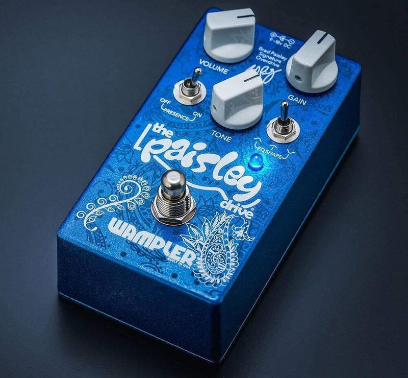 A Wampler Paisley Drive V2 Overdrive Distortion pedal with a white knob on it, designed for overdrive.
