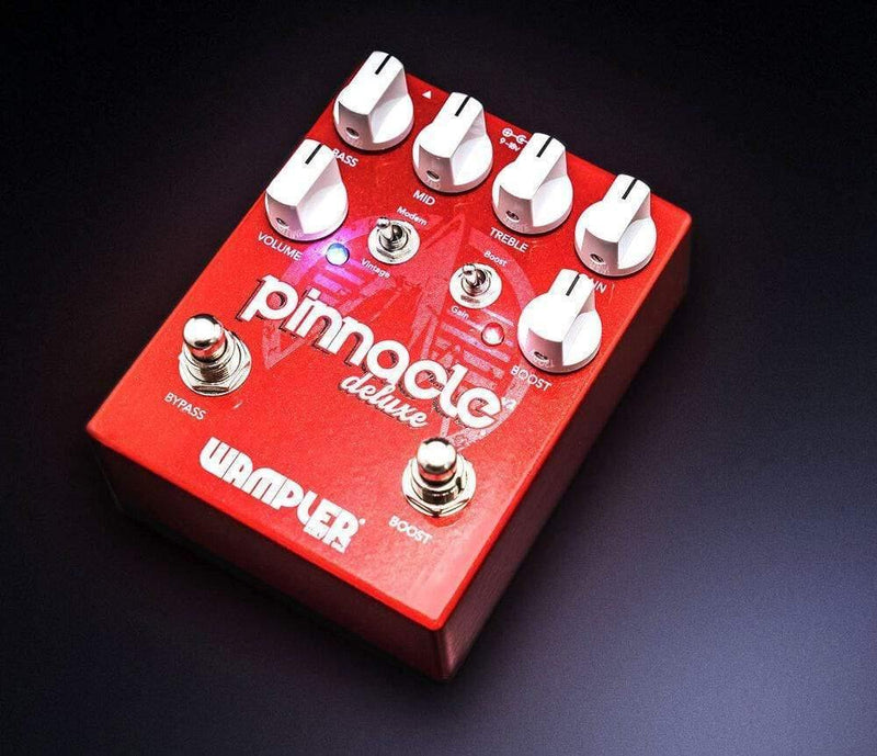 A versatile Wampler Pinnacle Deluxe V2 Pedal Distortion with buttons on it that offers boost and EQ capabilities.