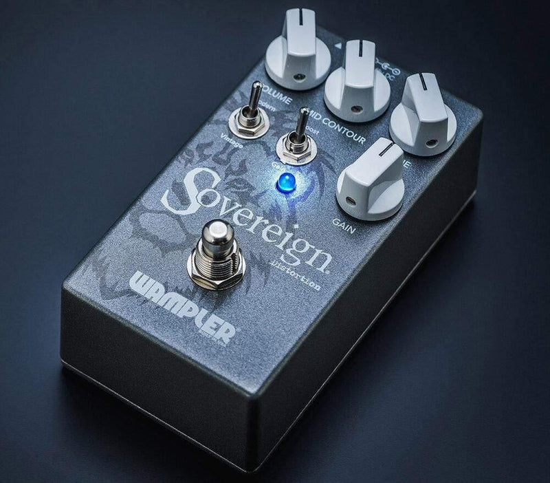 A versatile Wampler Sovereign Distortion V2 guitar pedal with a blue light on it.